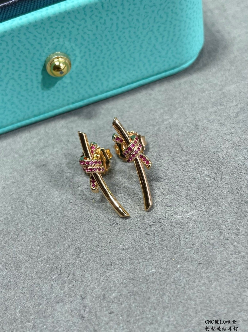 T*f*ny earrings
